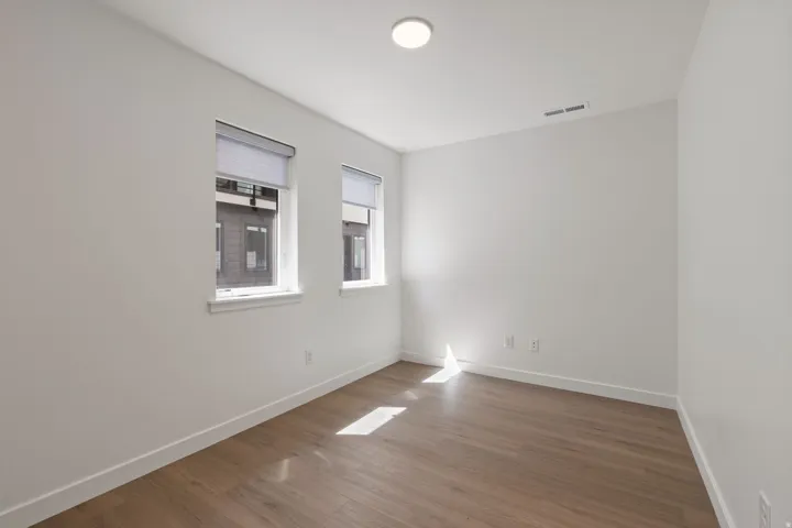 White walls with wood-finish flooring