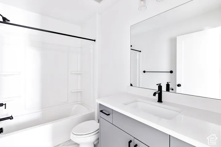 White shower/tub combination with black fixtures
