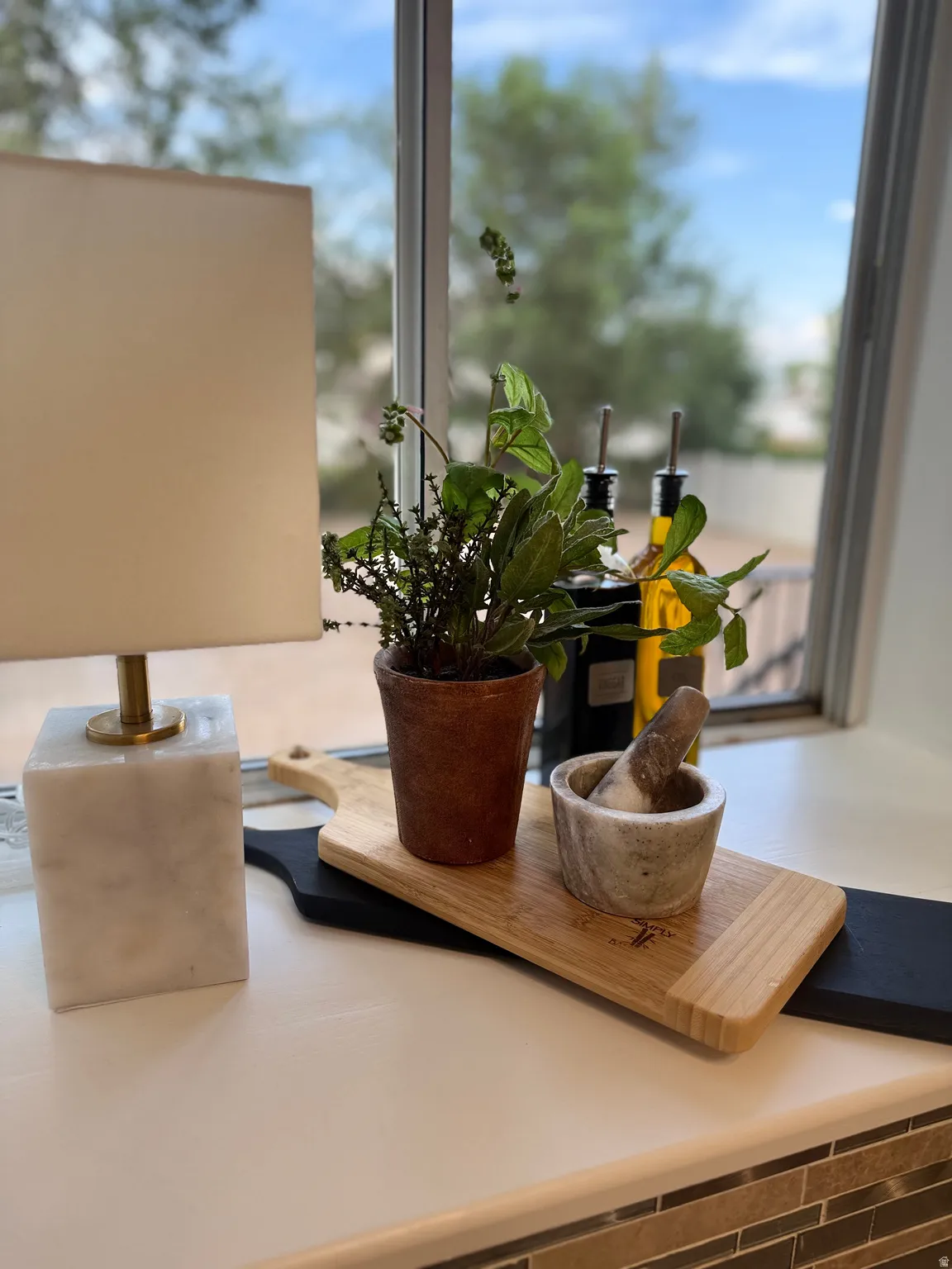 White windowsill with a tile backsplash