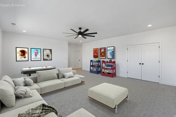 Recessed lighting, ceiling fan, carpeting, double closet doors with dark hardware, and light-colored walls