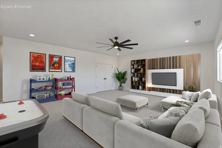 Spacious room featuring a ceiling fan, recessed lighting, and a built-in media center with shelving