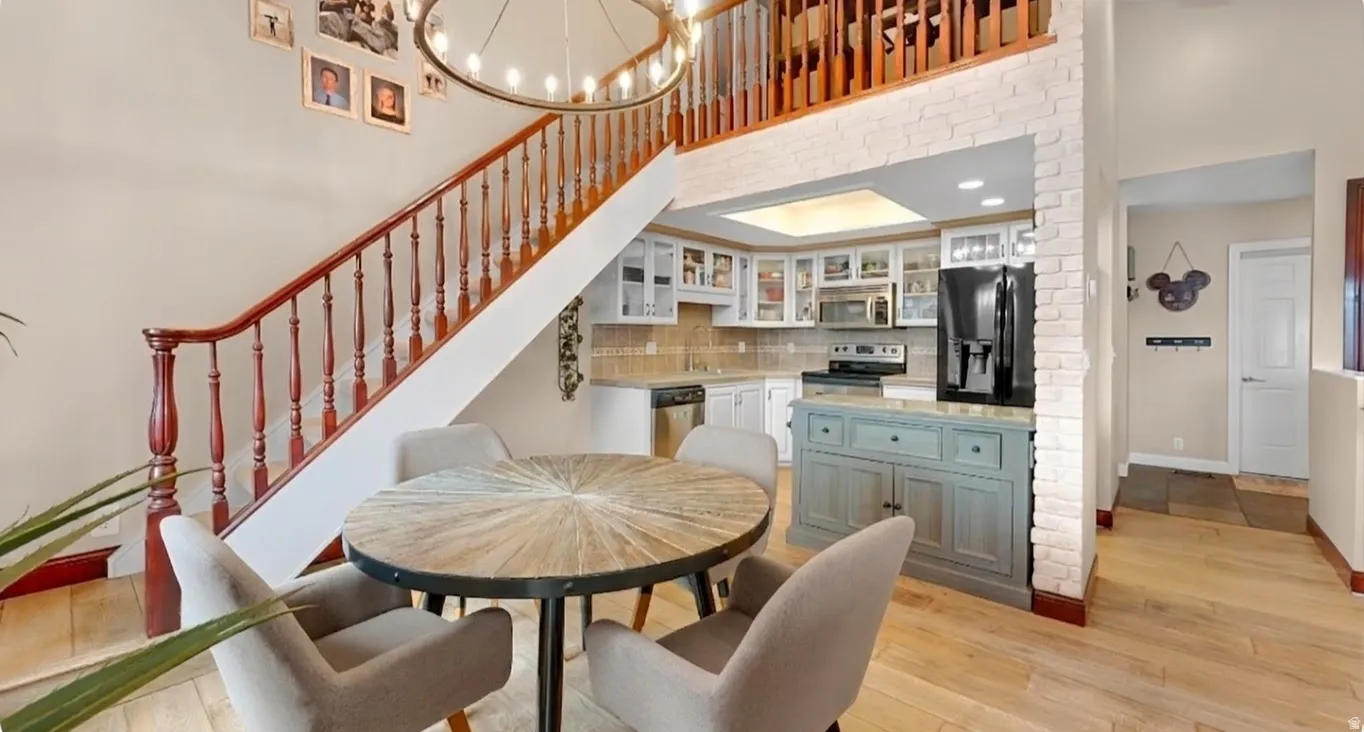 Hardwood flooring and a staircase with wood banister