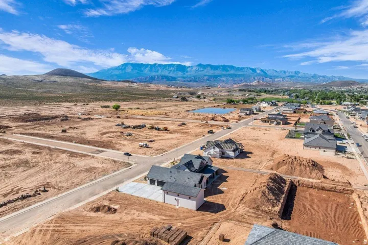 Expansive new construction home situated on generous acreage with dramatic mountain backdrop