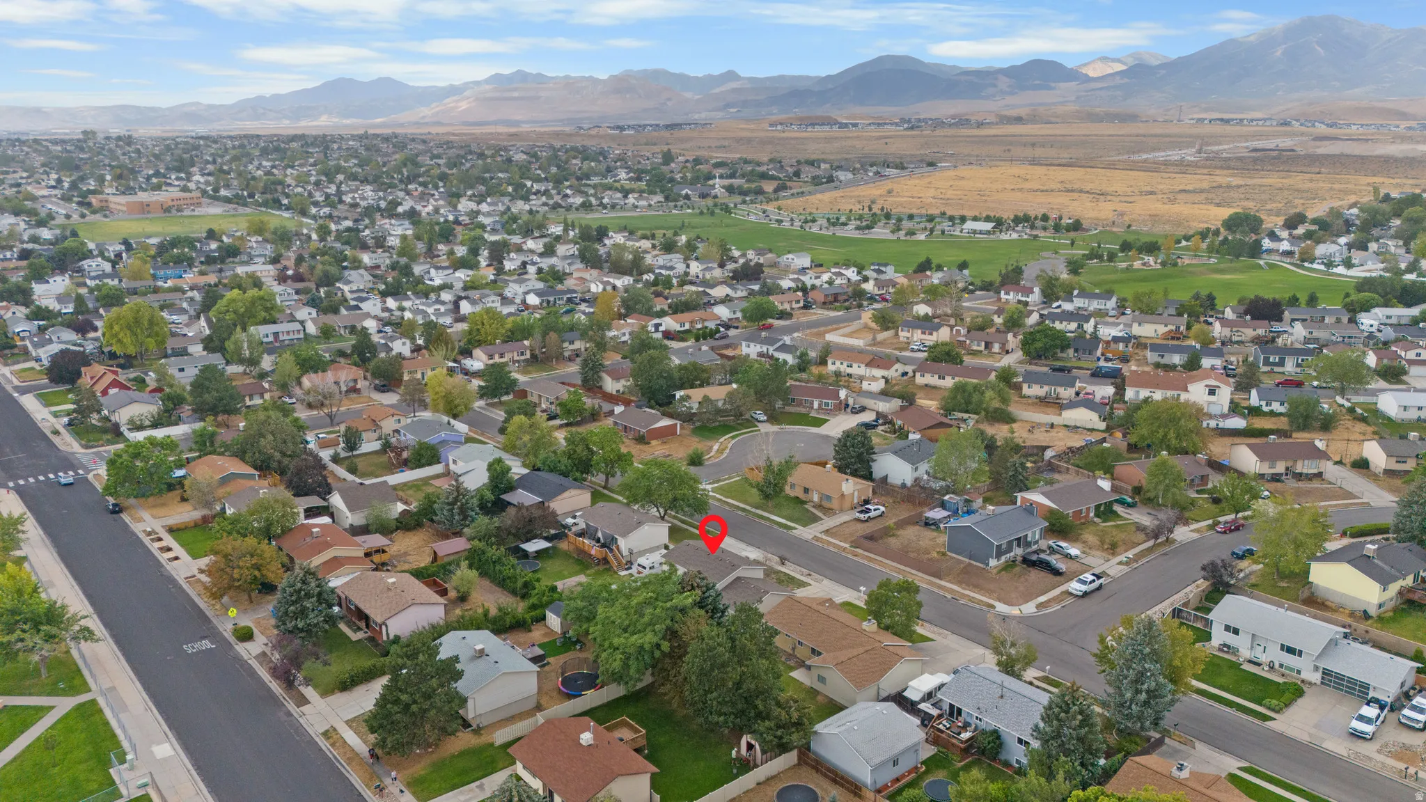 Established residential neighborhood with paved streets and mature trees