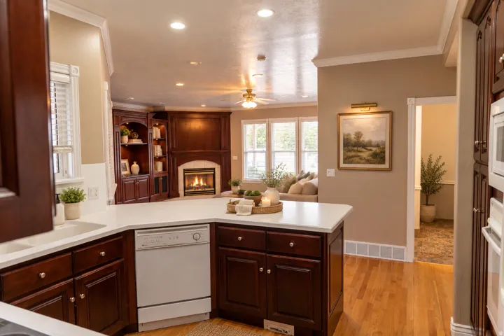 Kitchen with white countertops, wood-finish flooring, and recessed lighting