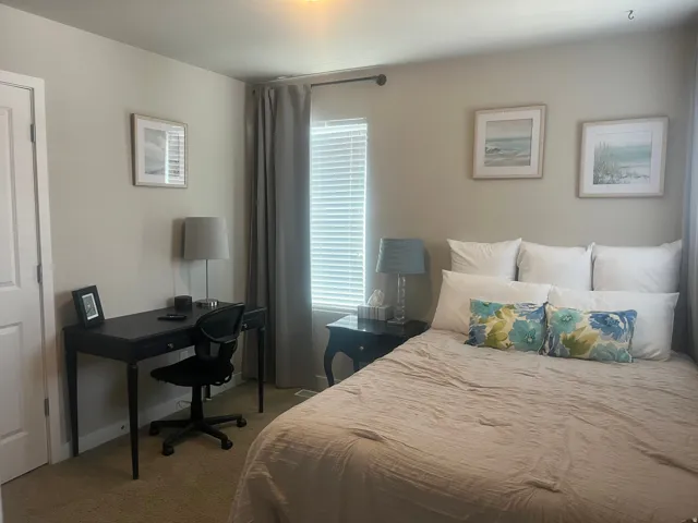 Window with horizontal blinds and drapery rod