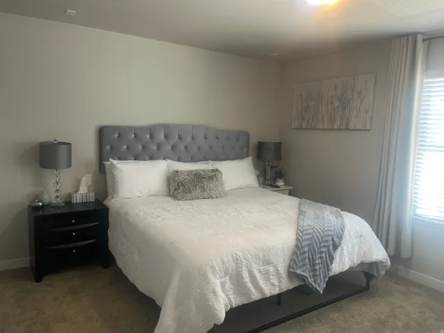 Carpeted flooring, window with blinds, and recessed lighting