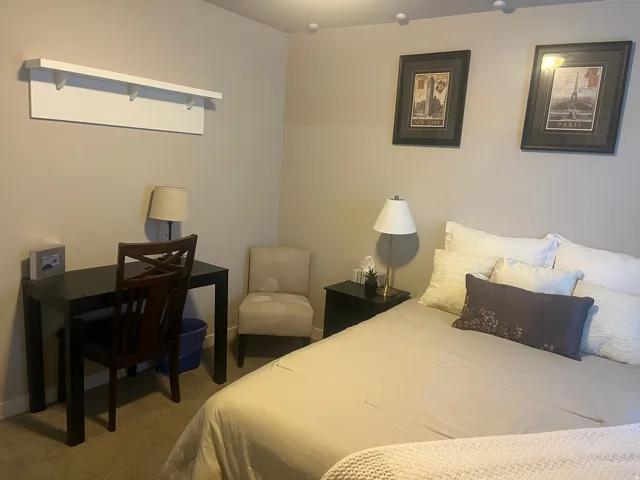 Neutral-toned walls complement plush carpeting