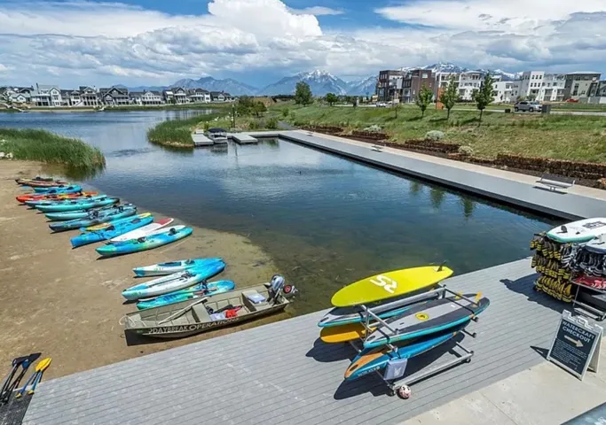 Waterfront access featuring a dock, a structured boardwalk, and a shoreline