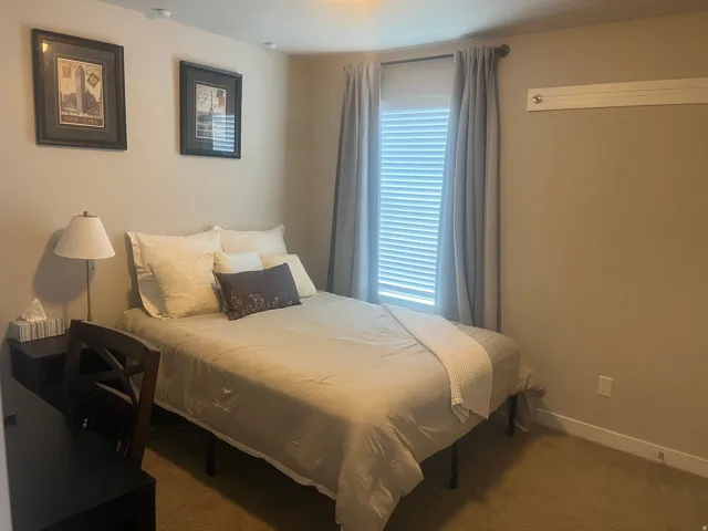 Carpeted flooring, window with blinds, and recessed lighting