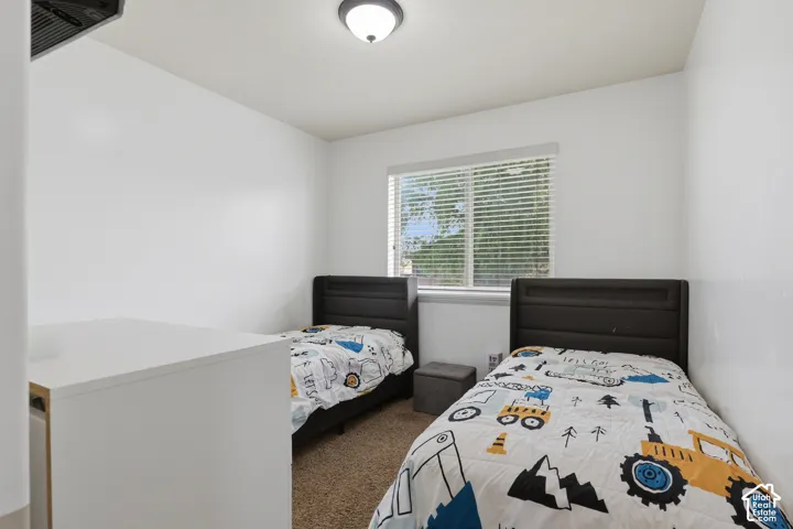 Recessed window with blinds, white walls, and a ceiling-mounted light fixture