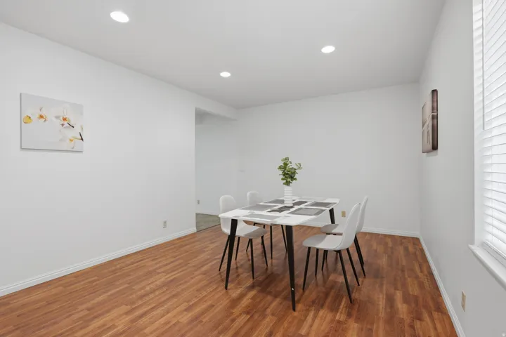 Wood-finish flooring throughout, complemented by recessed ceiling lighting
