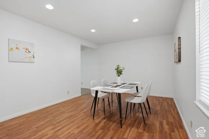 Wood-finish flooring throughout, complemented by recessed ceiling lighting