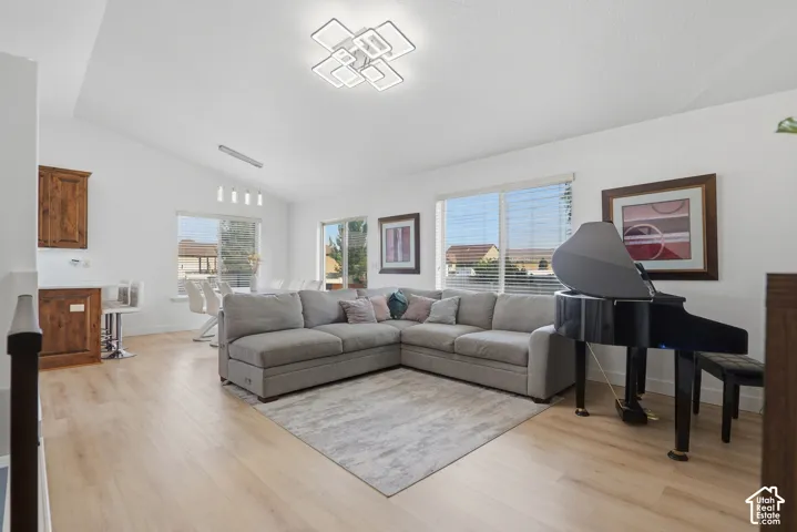 Vaulted ceiling with a contemporary flush-mount light fixture