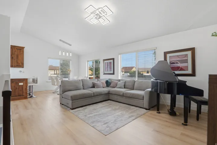 Vaulted ceiling with a contemporary flush-mount light fixture