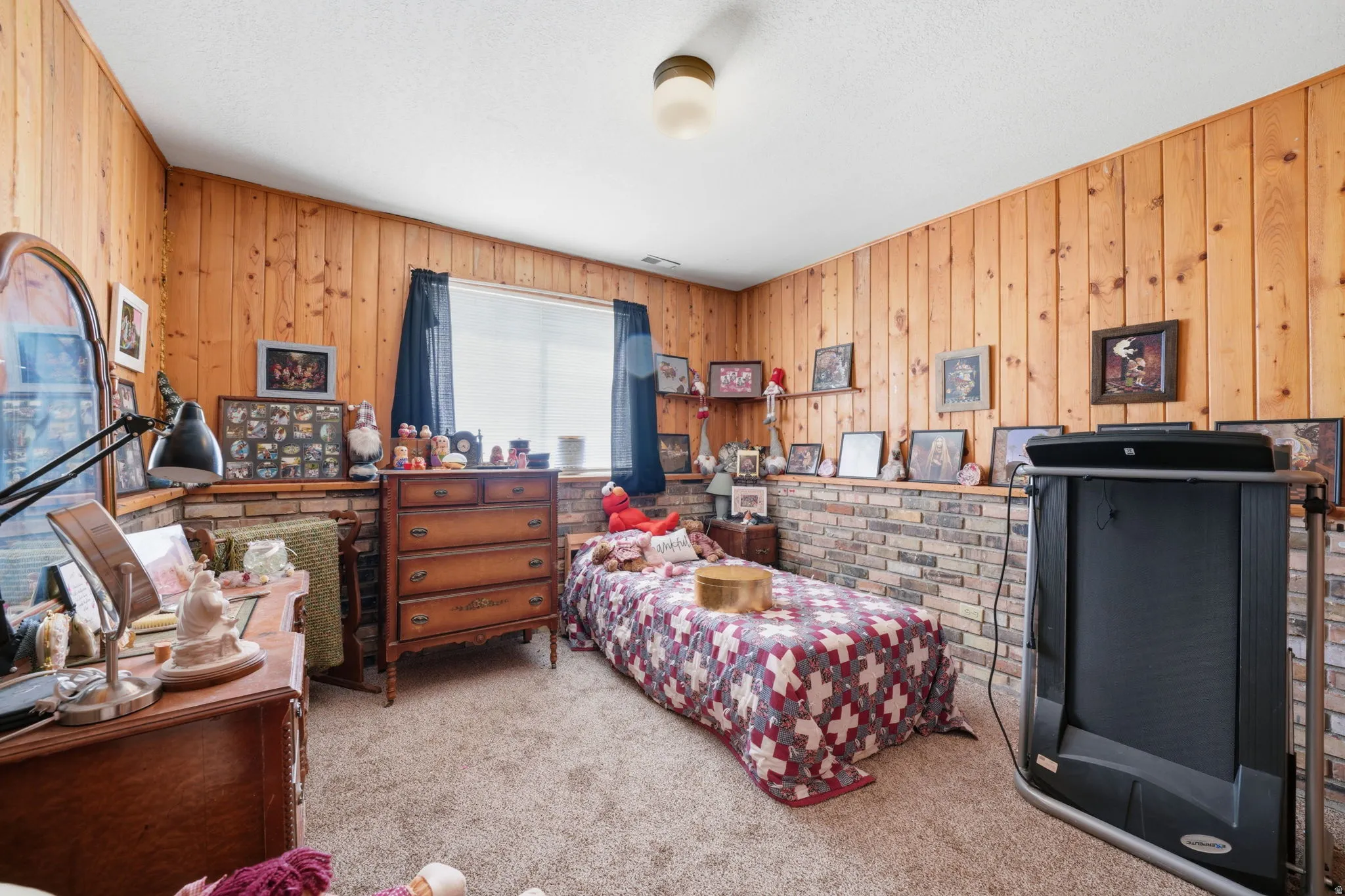 Wood-paneled walls and a window with blinds