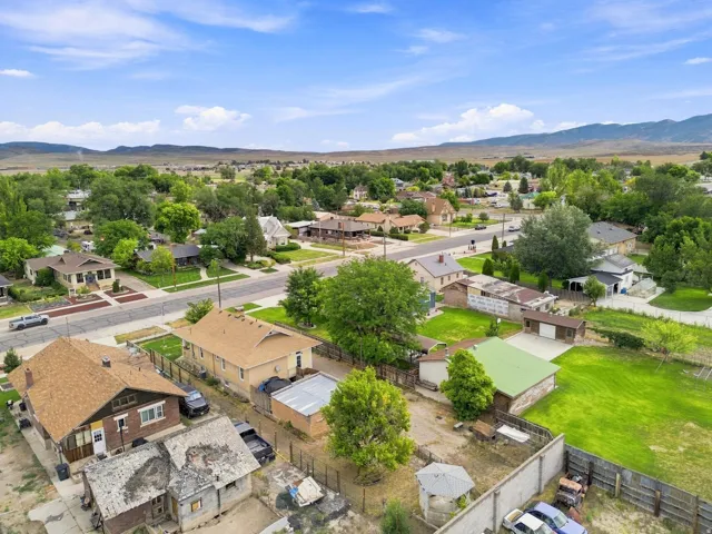 Neighborhood setting with mature trees and paved streets