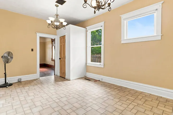 Geometric pattern flooring with dual bronze chandeliers