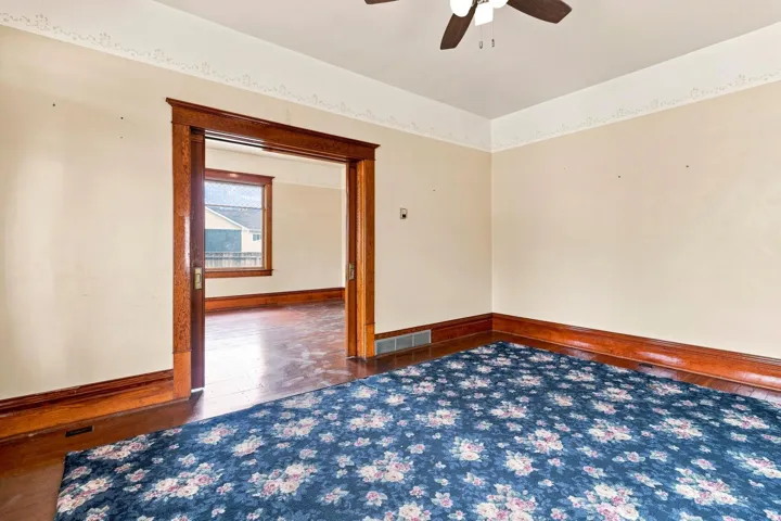 Wood-finish trim and baseboards complement the neutral wall tones