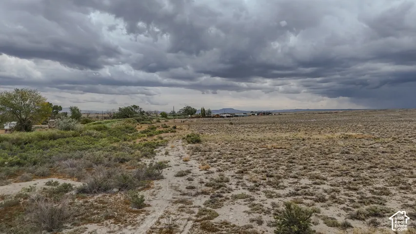 Expansive property featuring a mix of natural vegetation and open land