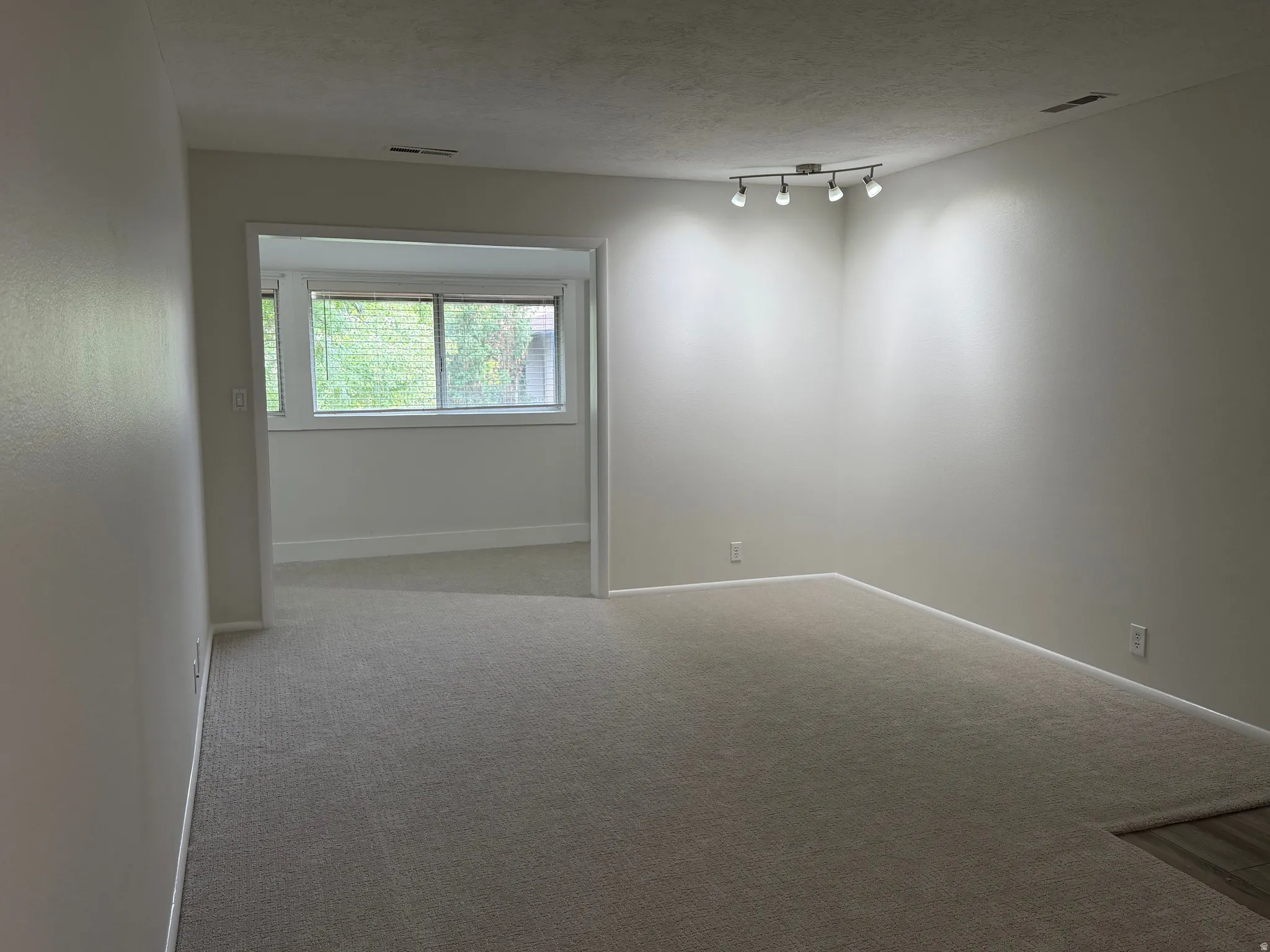 Neutral-toned carpeting throughout