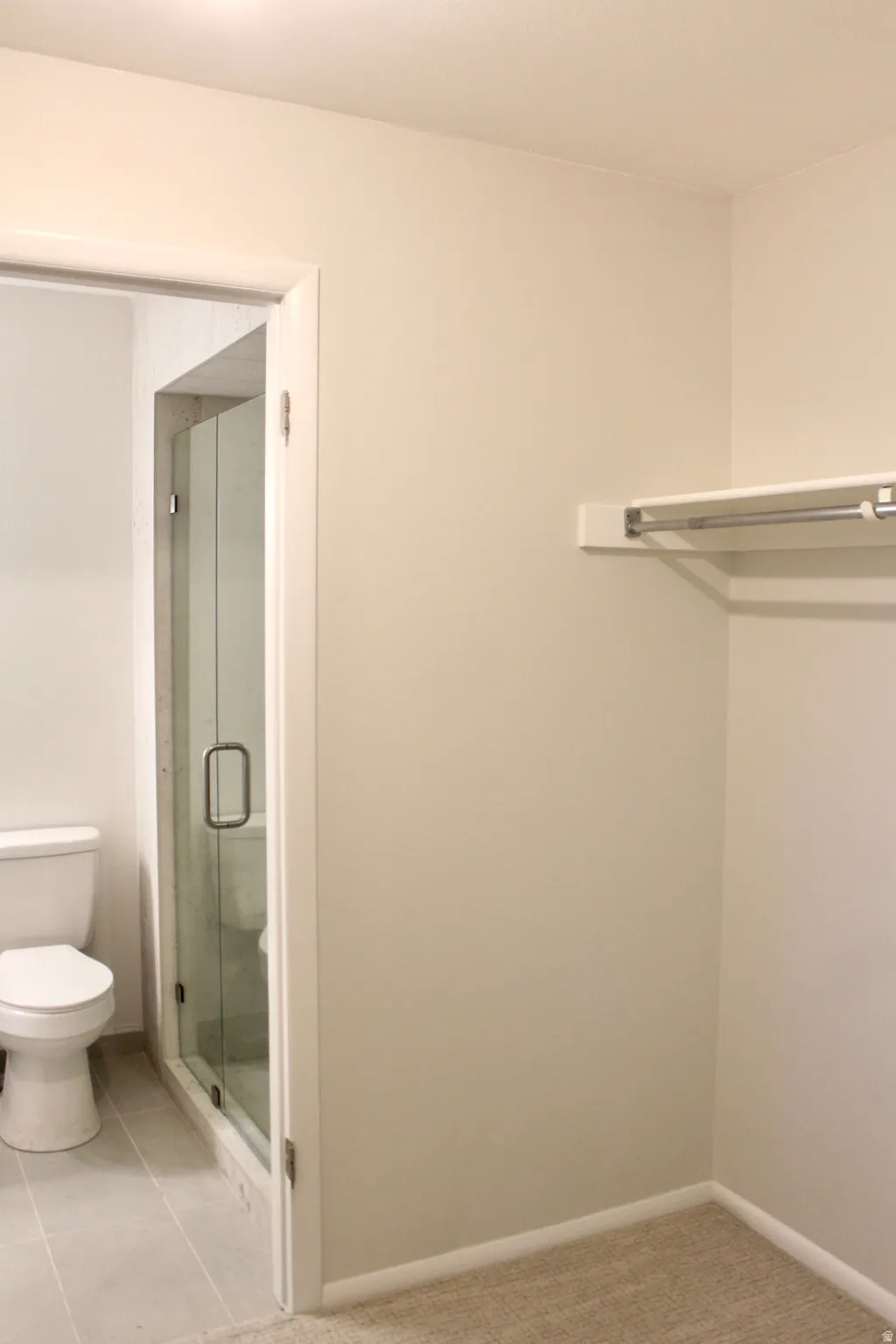 Neutral-toned walls with ceiling-mounted lighting