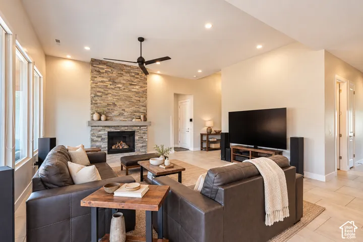 Stone-finish fireplace with a gas insert and wood mantel