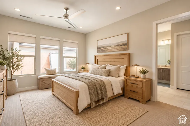 Recessed lighting, ceiling fan, three pane windows with roller shades, wood-finish flooring, and light-toned walls