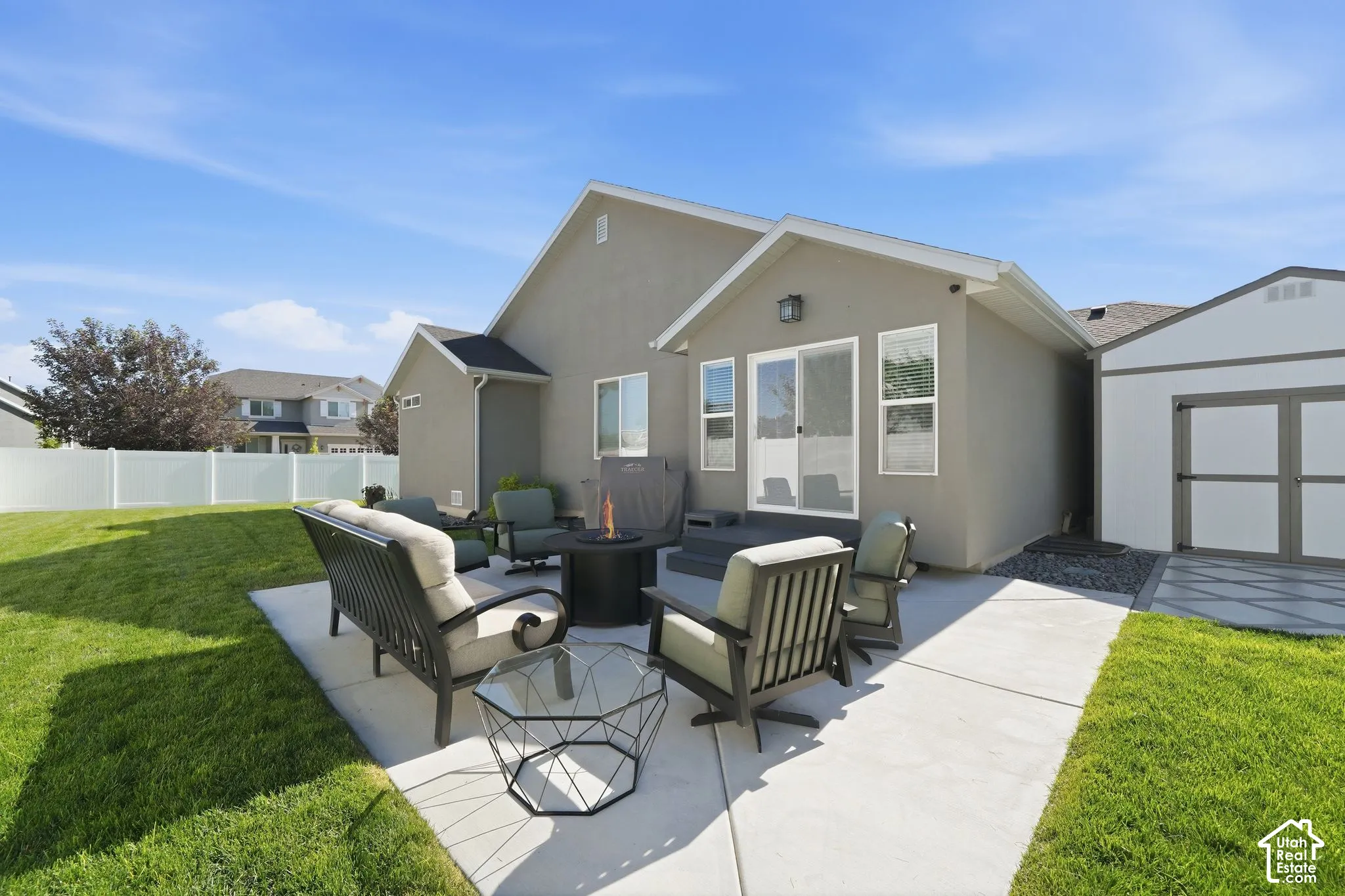 Expansive concrete patio with direct access via sliding glass doors
