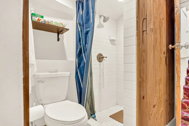 White ceramic toilet with chrome hardware