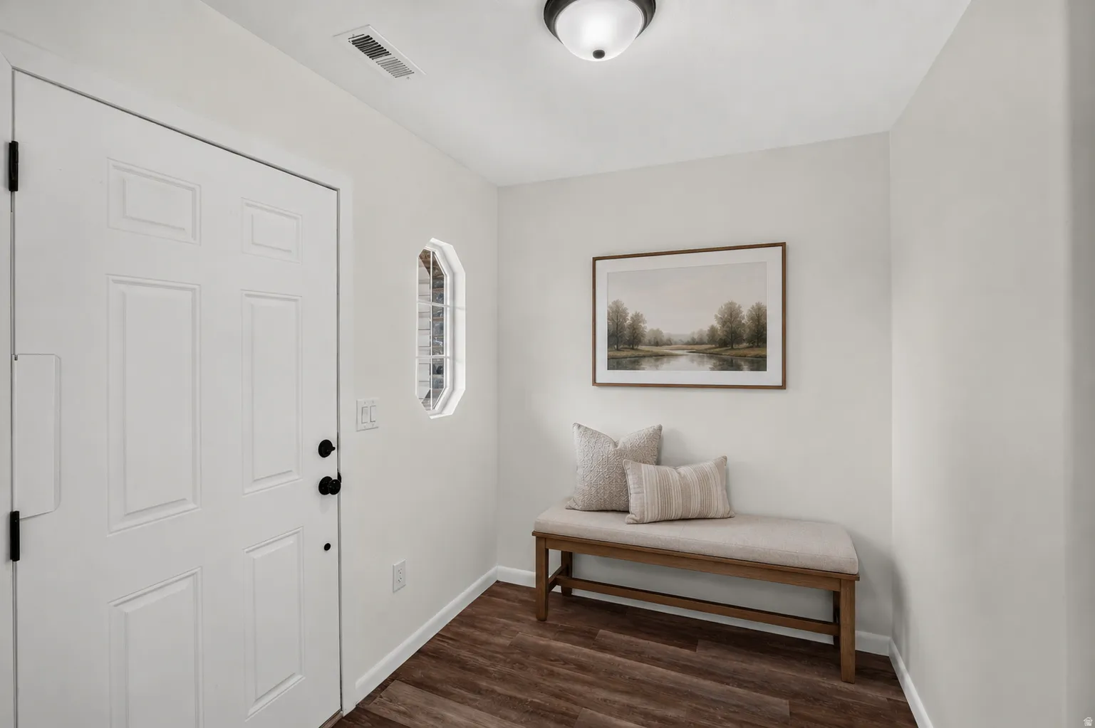 Virtually Staged - Crisp white entry door with matte black hardware