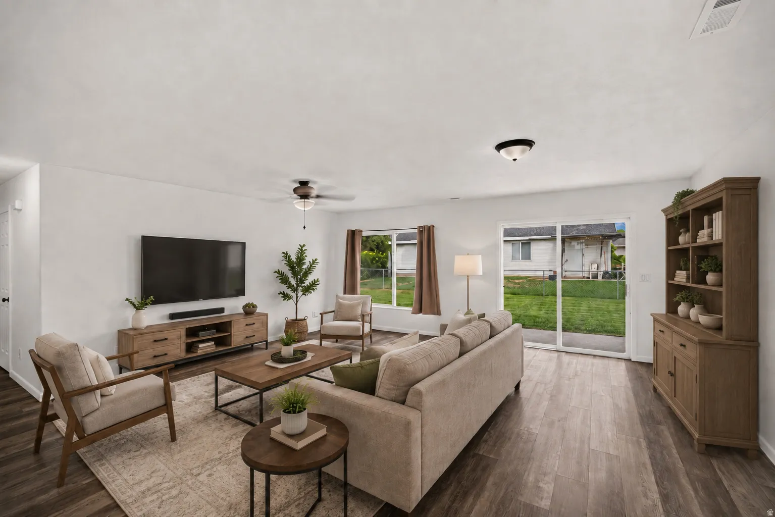 Virtually Staged - Hardwood-style flooring throughout, with white walls and a ceiling fan