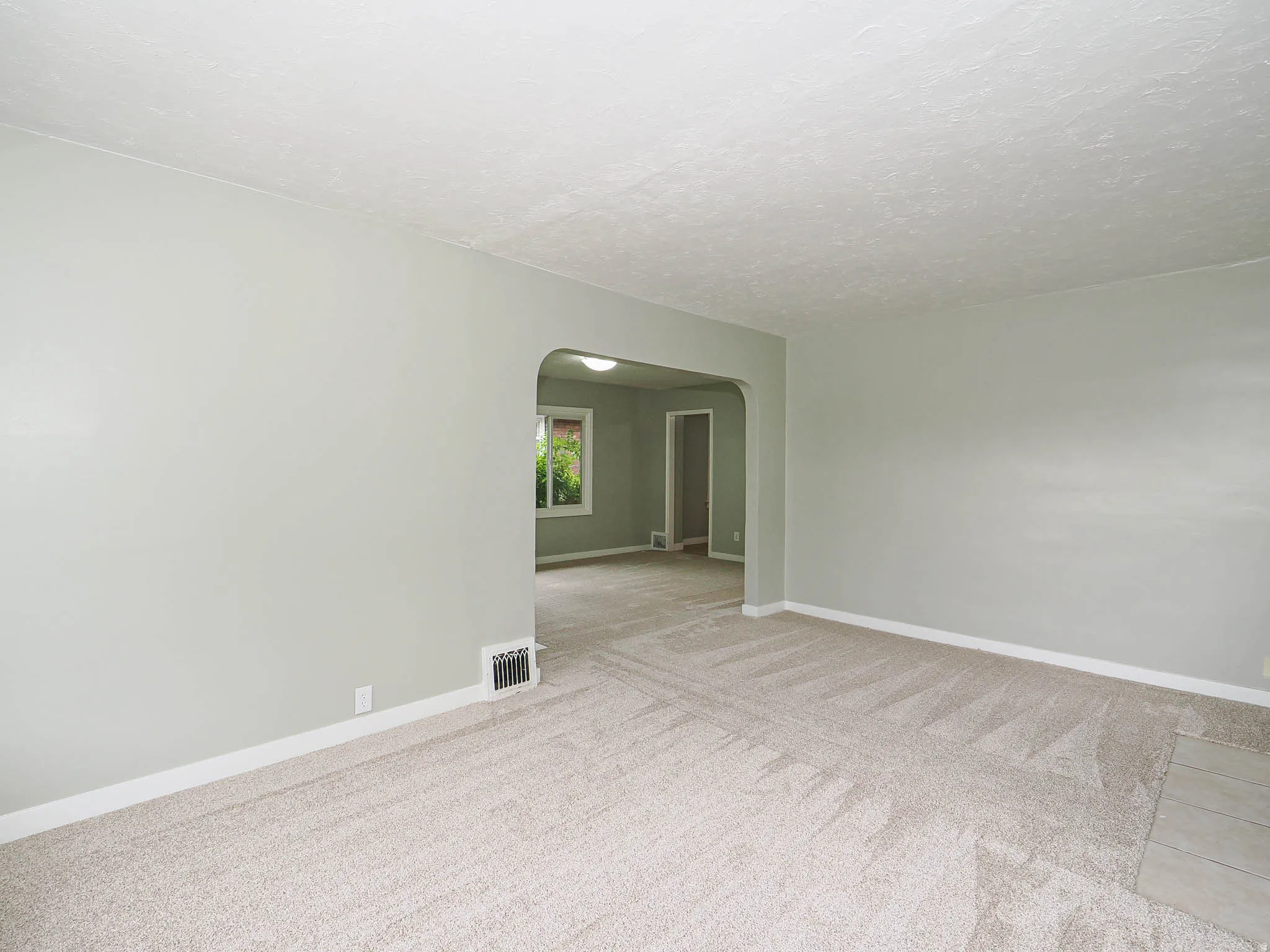 living room view to dining area and to kitchen