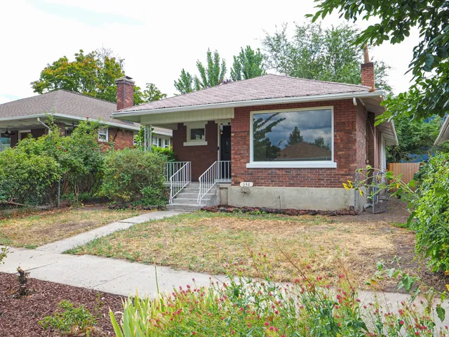 Brick exterior with a large front window