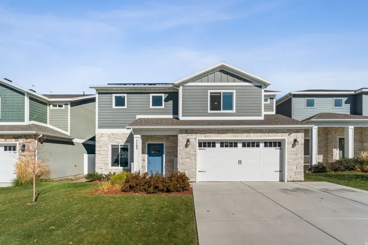 Contemporary two-story exterior with stone and horizontal siding accents