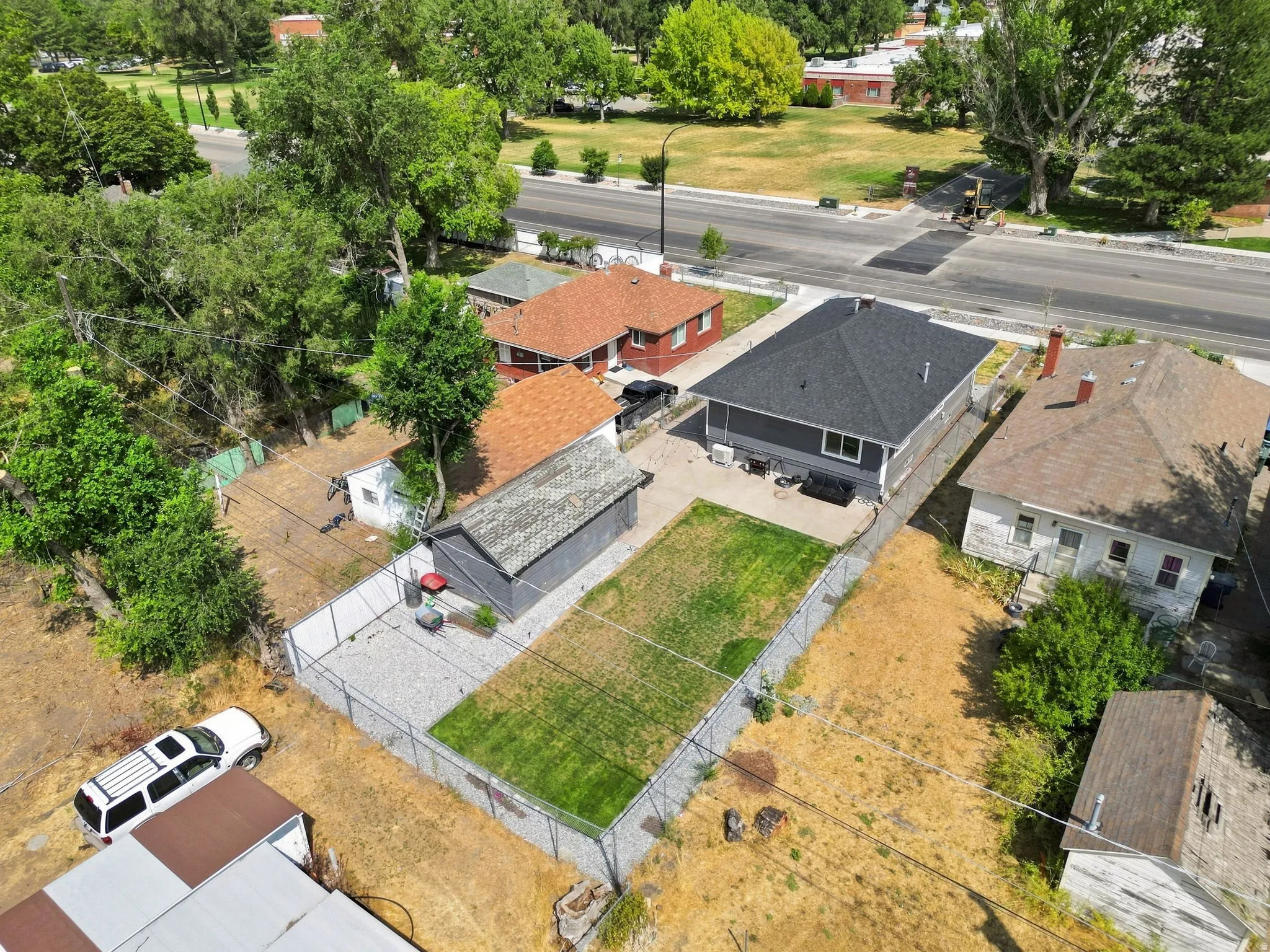 Fenced rear yard with a grass lawn