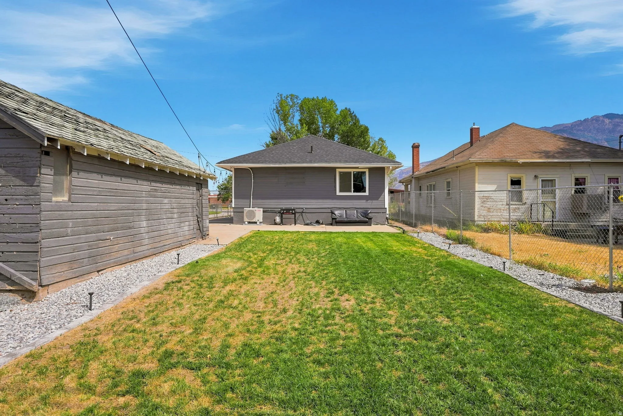 Expansive green space with defined gravel borders