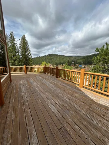 Expansive wood deck with natural wood railings