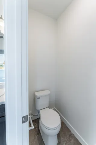 White toilet with a round bowl and tank