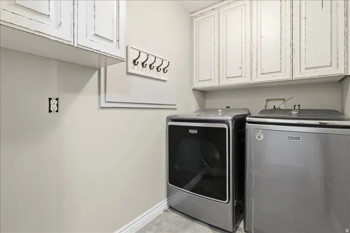 White upper cabinetry with distressed finish