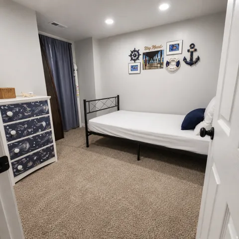 Plush carpet flooring, recessed ceiling lighting, and light gray wall paint