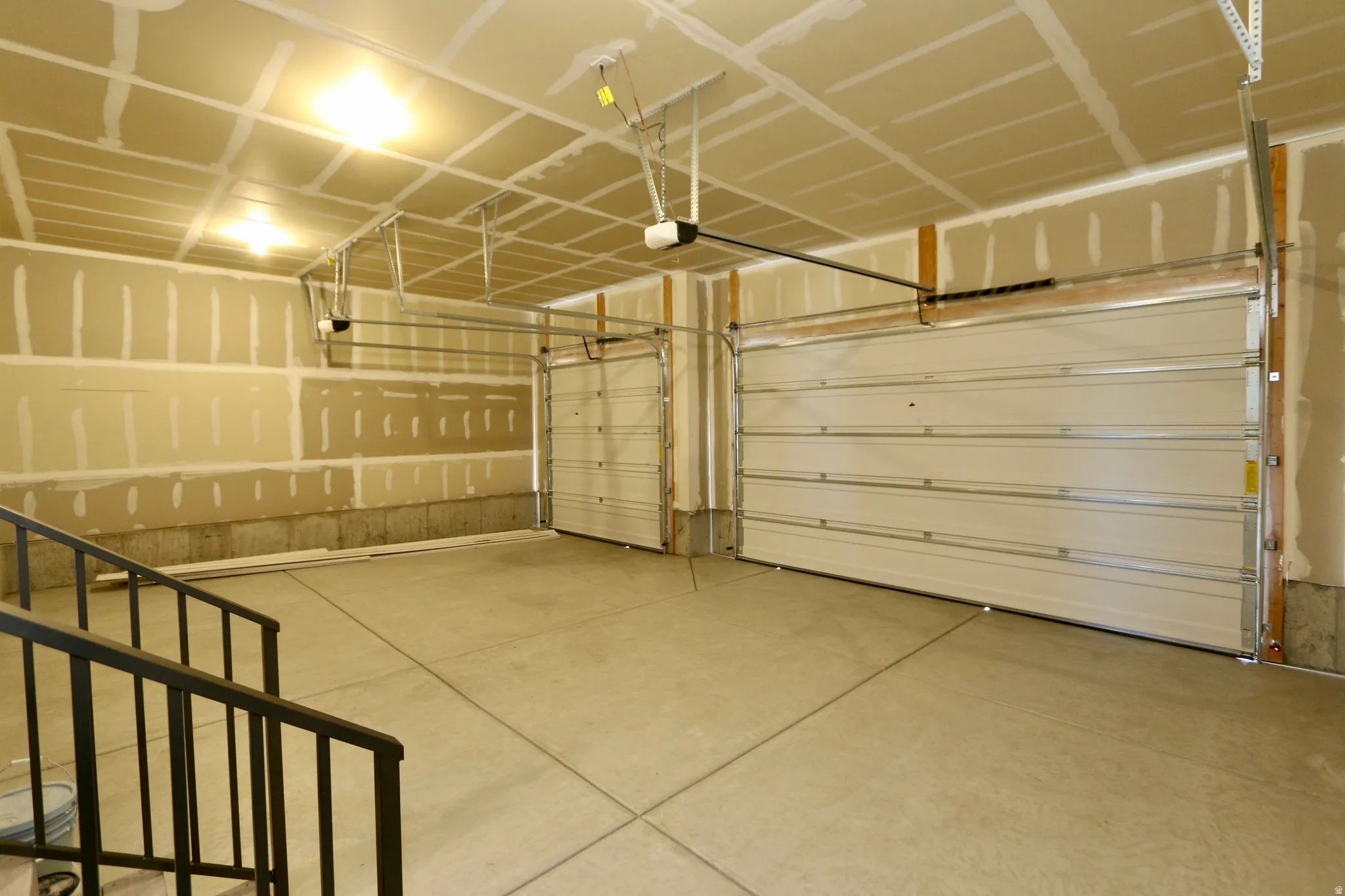 3 Car garage with automatic garage doors, soon to be painted/ finished.