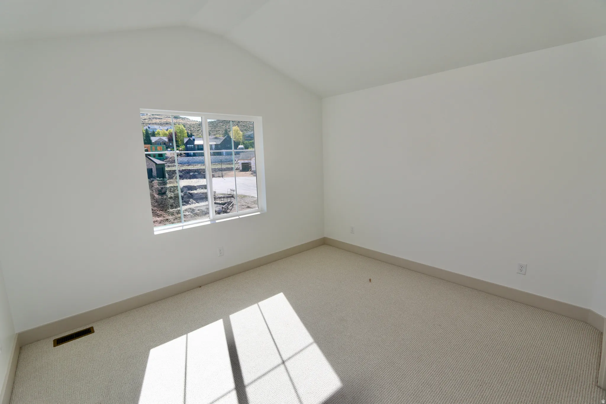 Bedroom #3 with vaulted ceiling,  large window