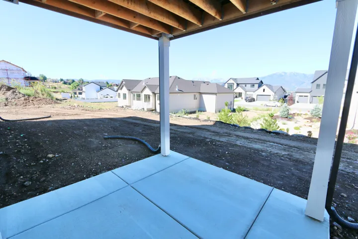 Walk-out basement entrance with glass french doors, covered patio that will be 18' X 11'