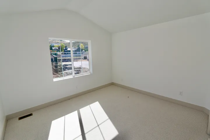 Bedroom #3 with vaulted ceiling,  large window
