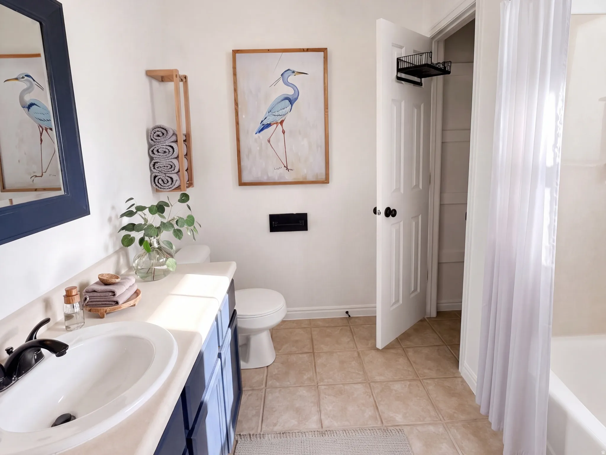 Primary Bathroom. Virtually Staged Image: This image has been digitally enhanced with AI-generated furniture and décor to illustrate potential use of the space. The property is currently vacant