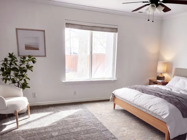 Primary Bedroom. Virtually Staged Image: This image has been digitally enhanced with AI-generated furniture and décor to illustrate potential use of the space. The property is currently vacant
