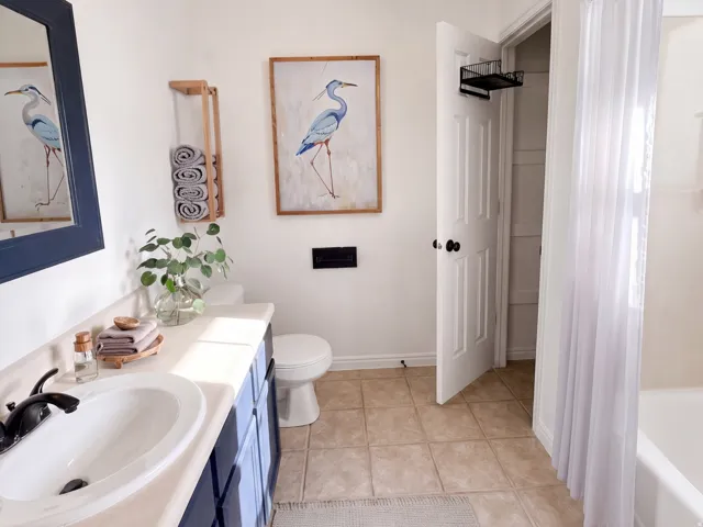 Primary Bathroom. Virtually Staged Image: This image has been digitally enhanced with AI-generated furniture and décor to illustrate potential use of the space. The property is currently vacant