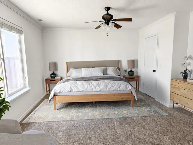 Primary Bedroom. Virtually Staged Image: This image has been digitally enhanced with AI-generated furniture and décor to illustrate potential use of the space. The property is currently vacant