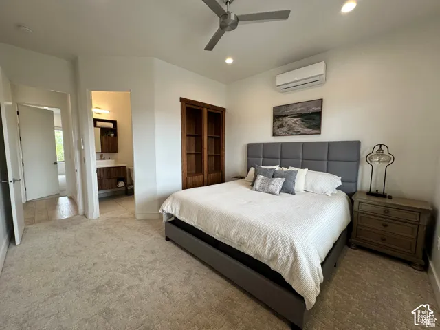 Wall-mounted air conditioning unit, modern ceiling fan, recessed lighting, built-in shelving, and light-toned carpeting